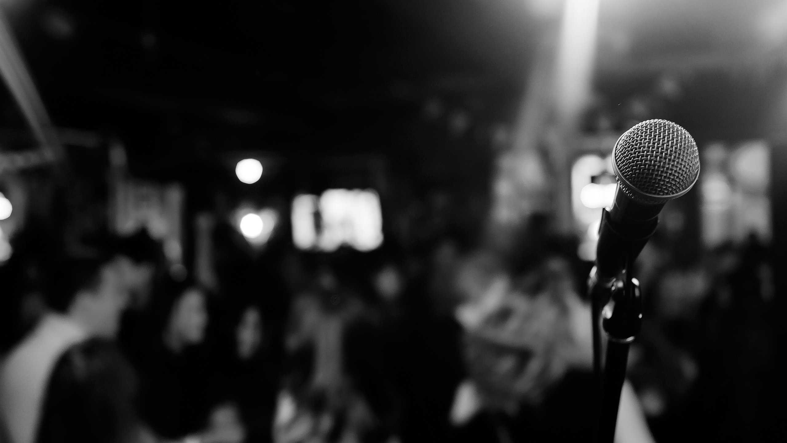 Black & White Photo of Microphone on Stage