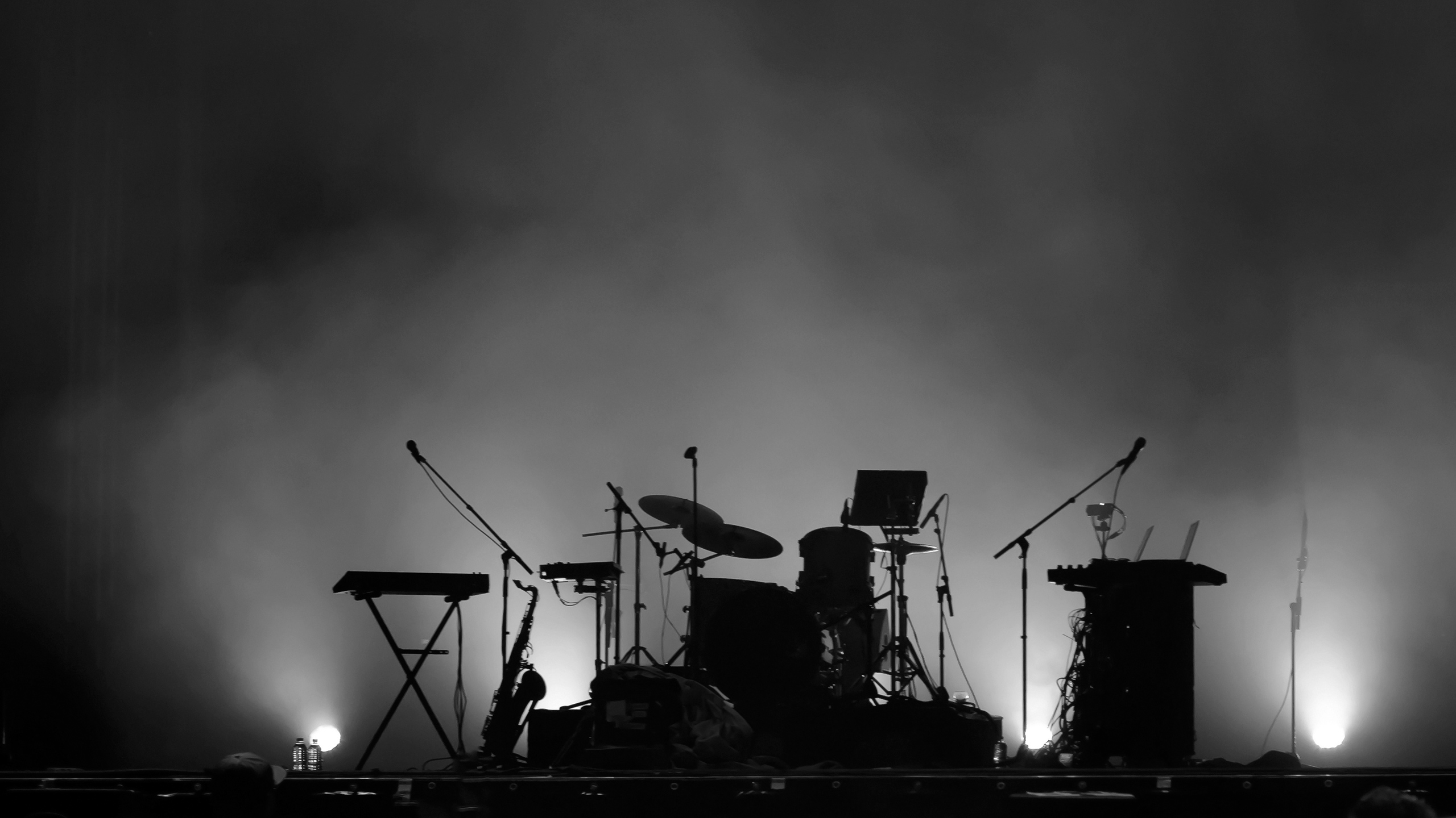 Black & White Photo of Instruments on Stage in Silhouette